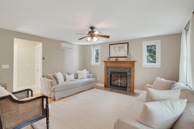 71 Sixth St N, Edgartown, MA 02539 - living area with a wall mounted air conditioner, plenty of natural light, ceiling fan, and a fireplace