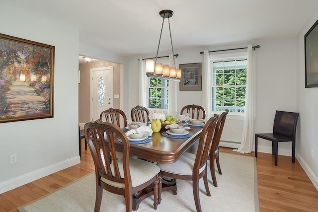 71 Sixth St N, Edgartown, MA 02539 - dining space with light wood-style floors, baseboards, and a baseboard heating unit