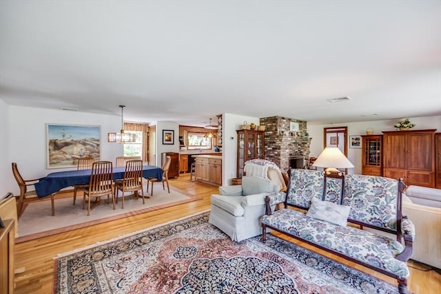 72 Highland Rd, Truro, MA 02666 - living area with light wood finished floors and a chandelier