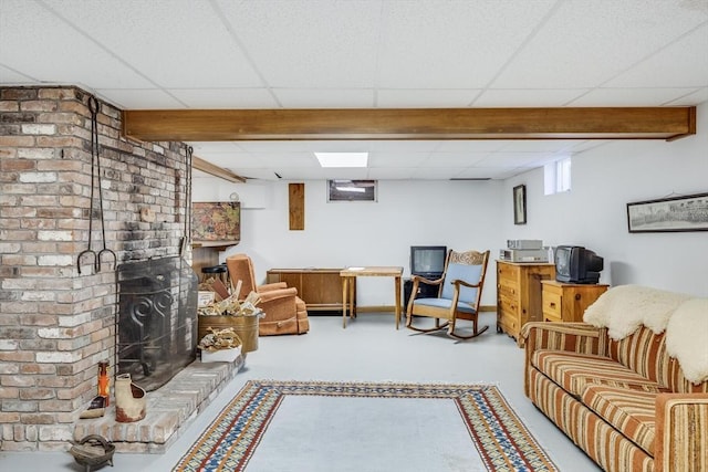 72 Highland Rd, Truro, MA 02666 - carpeted living room with a brick fireplace, a paneled ceiling, and beamed ceiling