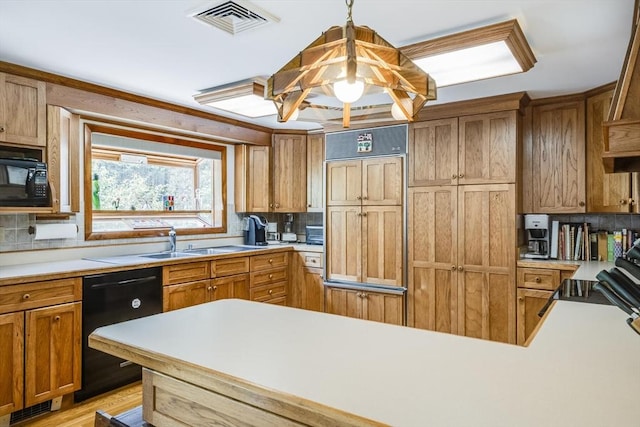 72 Highland Rd, Truro, MA 02666 - kitchen with black appliances, backsplash, light countertops, and decorative light fixtures