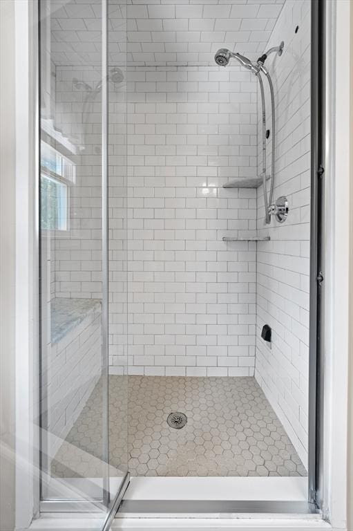 bathroom featuring a shower stall