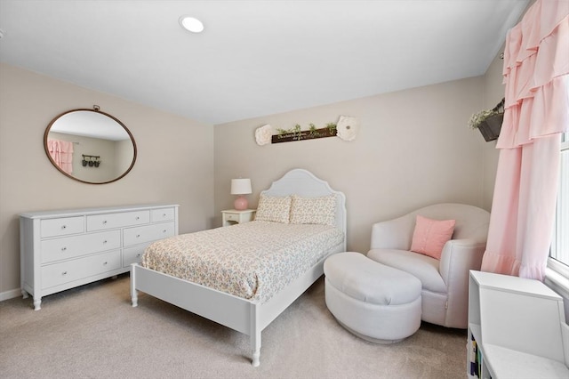 bedroom featuring light colored carpet