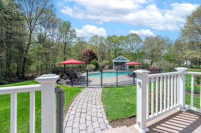 view of pool with a lawn, a patio, a fenced in pool, and fence