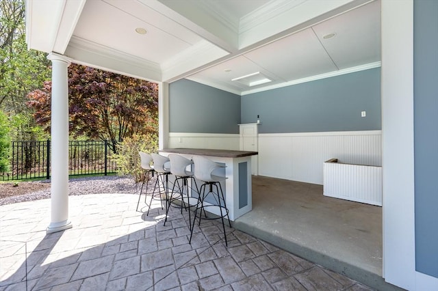 view of patio / terrace with fence and outdoor dry bar