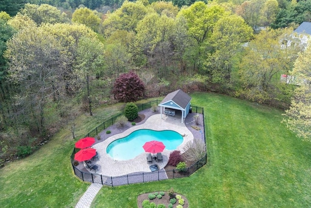 view of pool featuring a patio, a fenced in pool, a lawn, and a fenced backyard