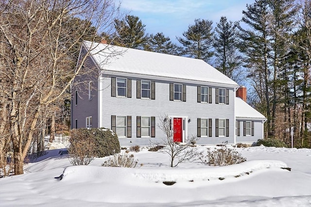 colonial inspired home with a chimney