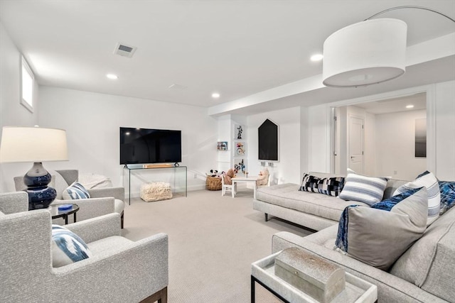 carpeted living room with baseboards, recessed lighting, and visible vents