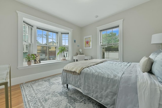 6 Brewer St Unit 2, Cambridge, MA 02138 - bedroom featuring multiple windows and wood finished floors