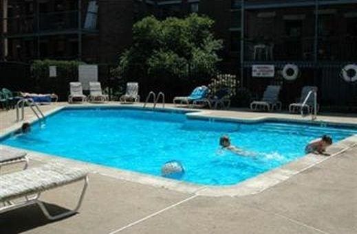 community pool with a patio area