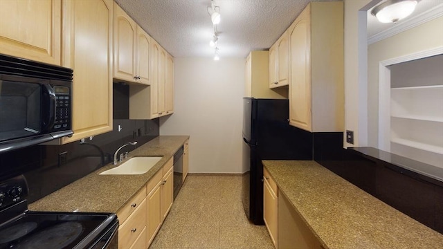 kitchen featuring black appliances, light brown cabinetry, a sink, baseboards, and stone countertops
