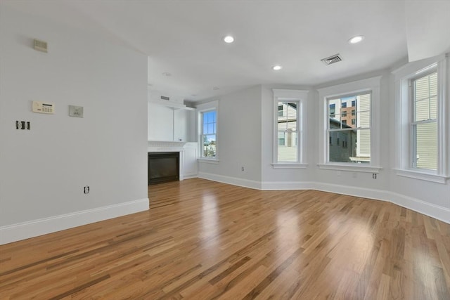 empty room with light hardwood / wood-style floors