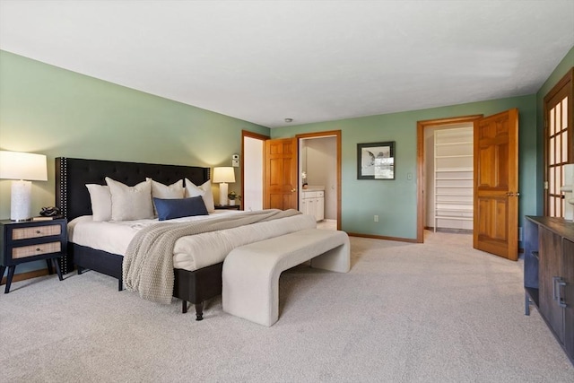 bedroom featuring baseboards and light carpet
