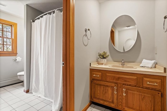 full bath featuring vanity, toilet, tile patterned floors, and a baseboard radiator
