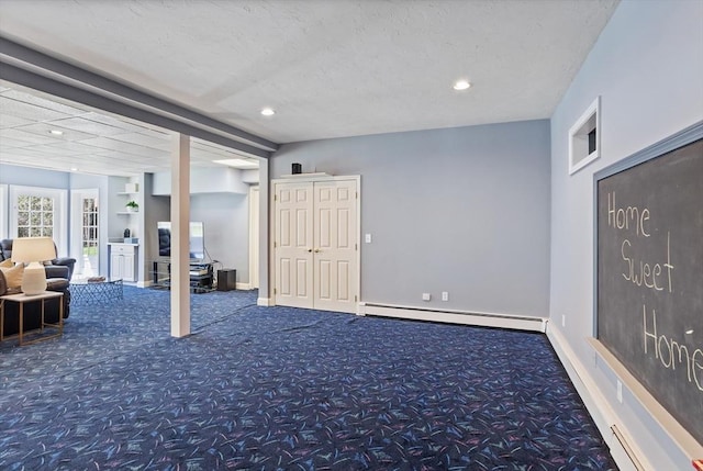 basement with built in features, carpet floors, a baseboard heating unit, and recessed lighting