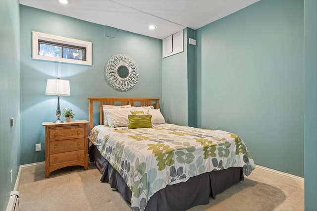carpeted bedroom with baseboards, recessed lighting, and a baseboard heating unit