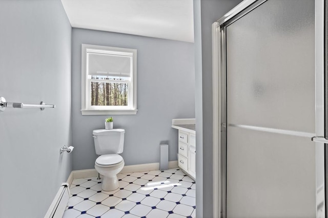 full bath with vanity, toilet, baseboards, tile patterned floors, and a shower stall