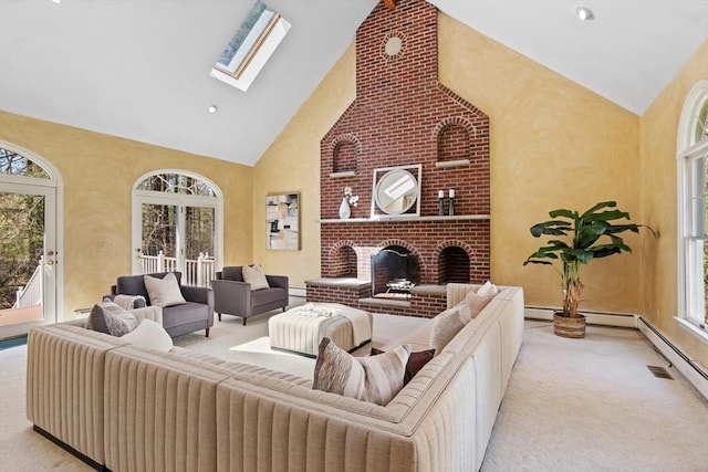 living room featuring carpet, a skylight, high vaulted ceiling, and a healthy amount of sunlight