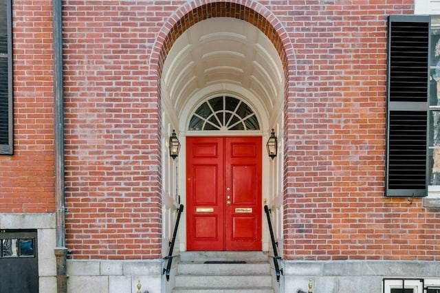 entrance to property with brick siding