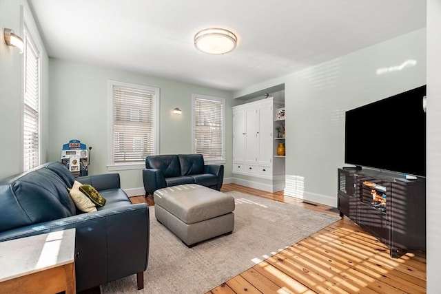 living room with wood finished floors and baseboards