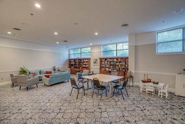 carpeted dining room with a wealth of natural light