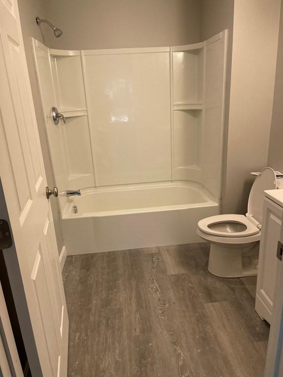 26 Wwebster Rd, Manchester, NH 03104 - full bathroom featuring wood finished floors, bathtub / shower combination, and vanity