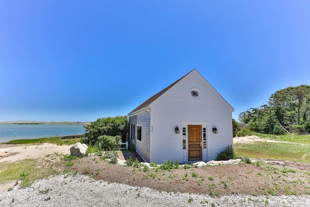 view of front facade with a water view