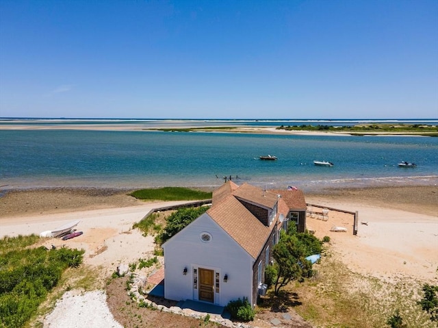 aerial view with a water view and a view of the beach