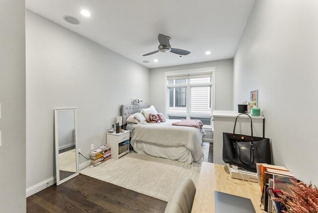 bedroom with dark wood finished floors, recessed lighting, ceiling fan, and baseboards
