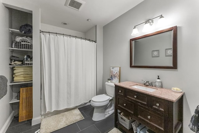 bathroom with toilet, vanity, a shower with shower curtain, and tile patterned floors