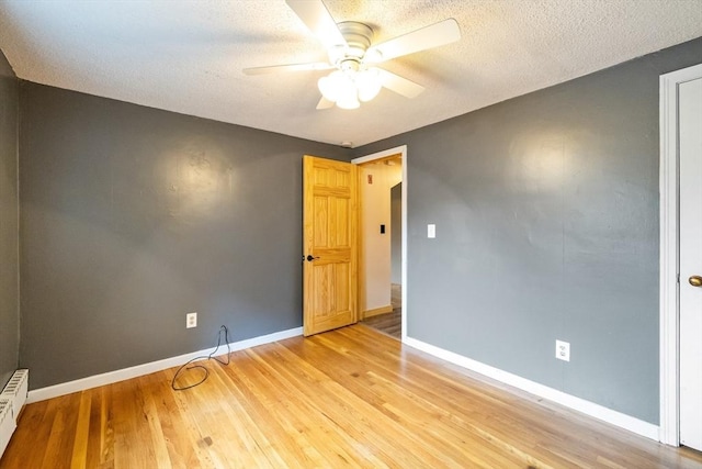 41 Yvette St, Chicopee, MA 01020 - unfurnished room with ceiling fan, light wood-style flooring, a textured ceiling, and a baseboard radiator
