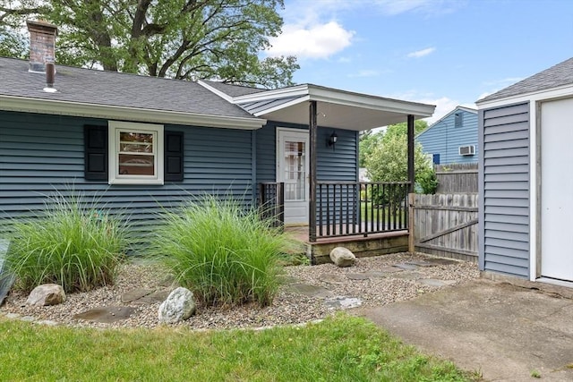 41 Yvette St, Chicopee, MA 01020 - doorway to property featuring a porch and roof with shingles