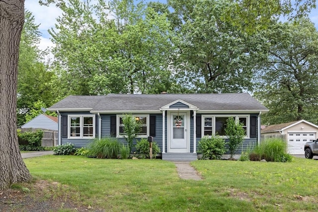 41 Yvette St, Chicopee, MA 01020 - view of front of home with a garage and an outdoor structure