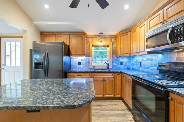 41 Yvette St, Chicopee, MA 01020 - kitchen featuring appliances with stainless steel finishes, healthy amount of natural light, a ceiling fan, brown cabinetry, and recessed lighting