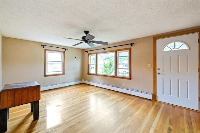 41 Yvette St, Chicopee, MA 01020 - entryway with a baseboard radiator, a textured ceiling, ceiling fan, and light wood finished floors