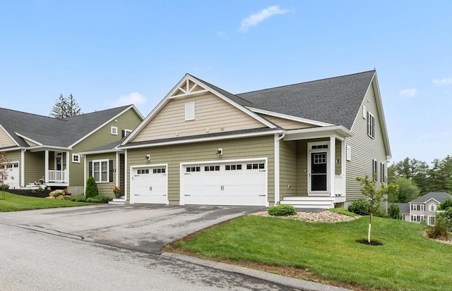 11 Soucy Dr Unit 11, Rutland, MA 01543 - view of front facade featuring a garage, asphalt driveway, and a front yard