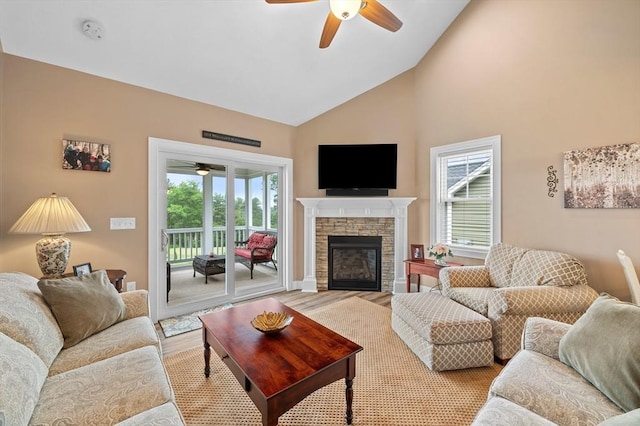 11 Soucy Dr Unit 11, Rutland, MA 01543 - living room featuring ceiling fan, high vaulted ceiling, a fireplace, and light wood finished floors