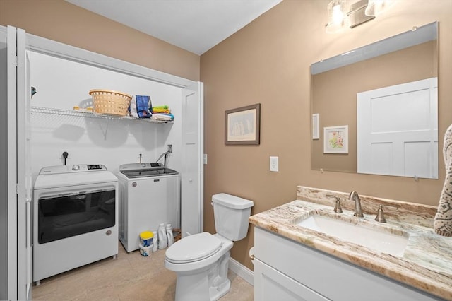 11 Soucy Dr Unit 11, Rutland, MA 01543 - bathroom with separate washer and dryer, vanity, and tile patterned flooring