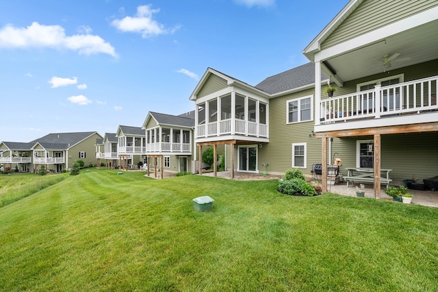 11 Soucy Dr Unit 11, Rutland, MA 01543 - back of house featuring a sunroom, a patio area, a yard, and roof with shingles