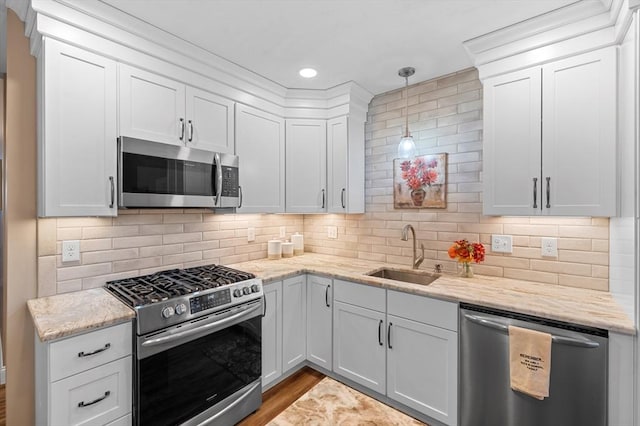 11 Soucy Dr Unit 11, Rutland, MA 01543 - kitchen featuring appliances with stainless steel finishes, white cabinetry, light stone countertops, pendant lighting, and recessed lighting