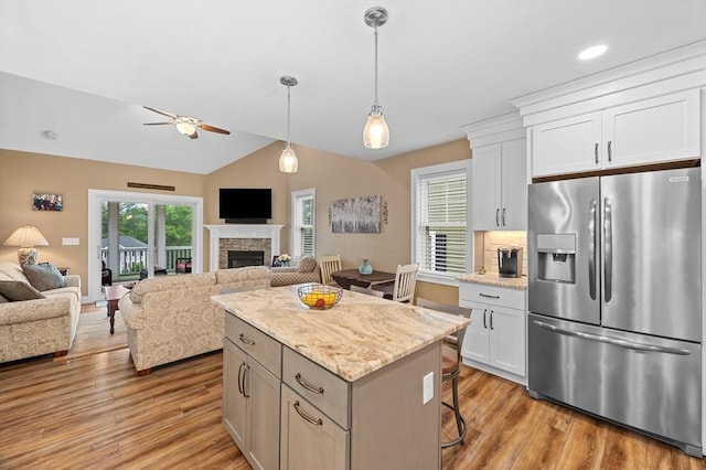 11 Soucy Dr Unit 11, Rutland, MA 01543 - kitchen featuring stainless steel refrigerator with ice dispenser, open floor plan, a ceiling fan, light wood-style flooring, and lofted ceiling