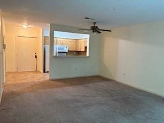 58 S St Unit 306, Quincy, MA 02169 - unfurnished living room featuring a ceiling fan and carpet flooring