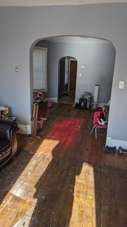 corridor featuring dark hardwood / wood-style floors