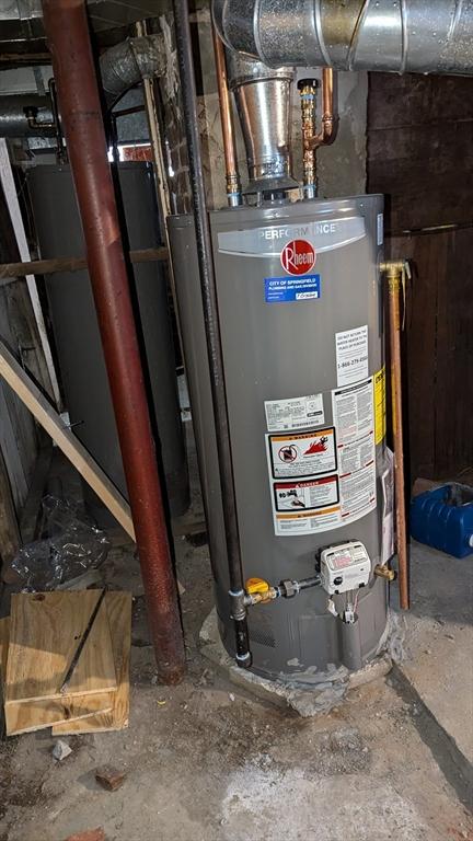 utility room featuring water heater