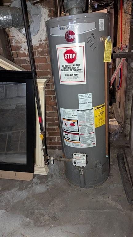 utility room with gas water heater