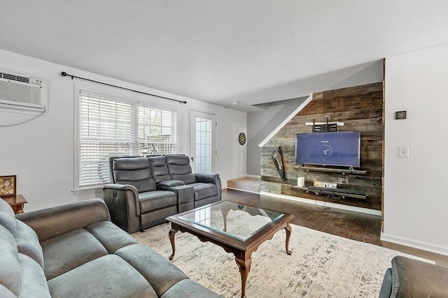 13 Berrington Rd Unit 13, Leominster, MA 01453 - living room with wood finished floors, a wall mounted air conditioner, and wood walls