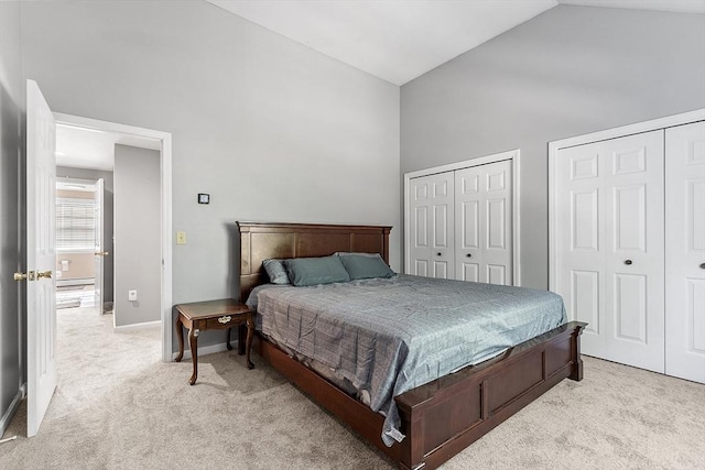 13 Berrington Rd Unit 13, Leominster, MA 01453 - bedroom featuring two closets, light colored carpet, high vaulted ceiling, and baseboard heating