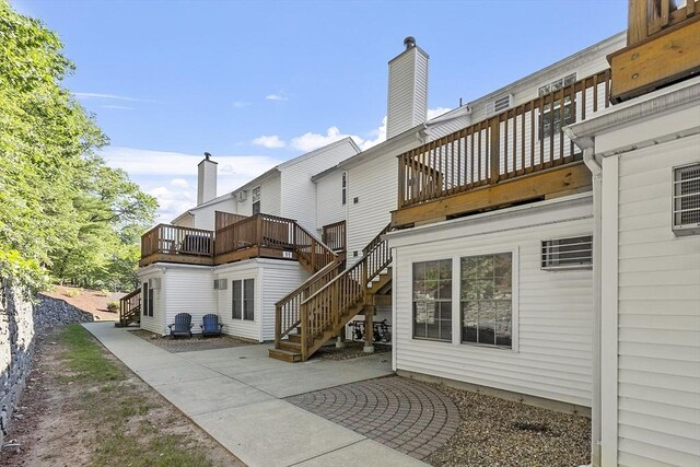 13 Berrington Rd Unit 13, Leominster, MA 01453 - rear view of property featuring a balcony, stairs, and a patio area