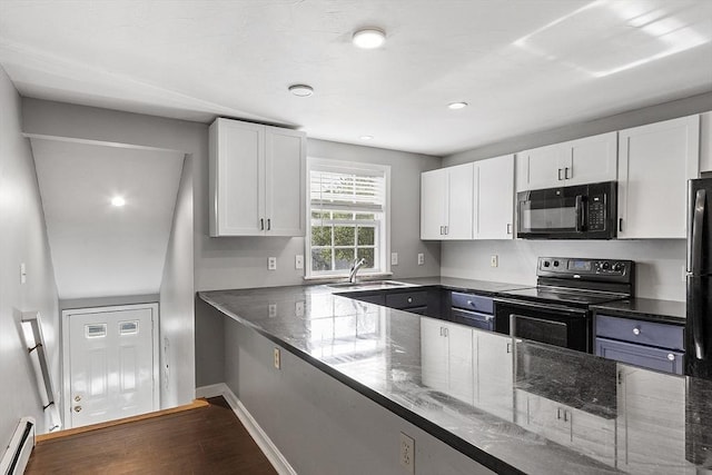 13 Berrington Rd Unit 13, Leominster, MA 01453 - kitchen featuring black appliances, a baseboard heating unit, dark stone countertops, white cabinetry, and recessed lighting