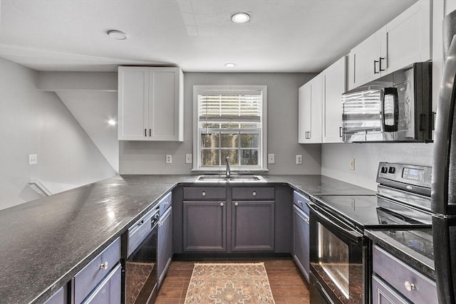 13 Berrington Rd Unit 13, Leominster, MA 01453 - kitchen featuring black range with electric cooktop, dark countertops, dark wood-style floors, white cabinets, and recessed lighting